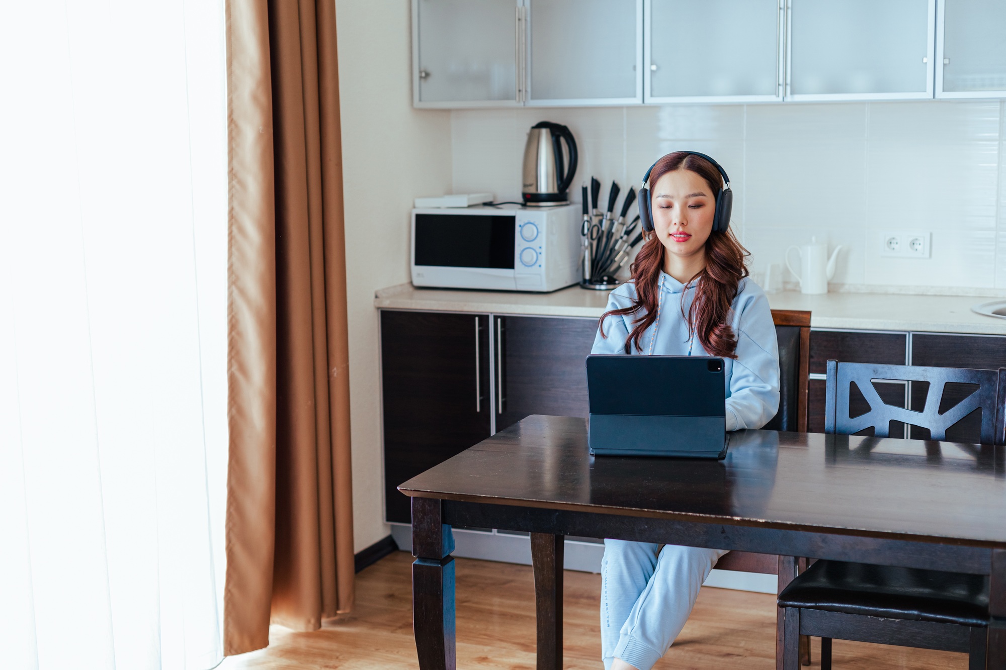 Freelance asian woman working at home